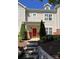 Inviting exterior of a two-story townhome with red door at 18107 Amberwood Glen Dr, Cornelius, NC 28031