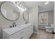 Bathroom featuring double vanity, modern lighting, and white cabinetry for ample storage at 2029 Big Dipper Dr, Clover, SC 29710