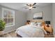 Bright bedroom with wood bed frame and window at 2029 Big Dipper Dr, Clover, SC 29710