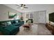 Living room with green sectional and wood coffee table at 2029 Big Dipper Dr, Clover, SC 29710