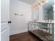 Bathroom features double vanity with stylish mirrors and modern fixtures with hard wood floors at 317 Belwood Dr, Belmont, NC 28012