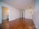 Bedroom features hardwood floors, three closets, and an elegant light fixture, creating a comfortable space at 317 Belwood Dr, Belmont, NC 28012