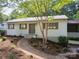 Charming single-story home featuring a landscaped front yard, walkway, and a welcoming entrance at 317 Belwood Dr, Belmont, NC 28012