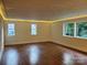 Bright living room featuring wood floors, recessed lighting, and large windows at 317 Belwood Dr, Belmont, NC 28012