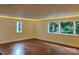 Bright living room features hardwood floors, recessed lighting, and large windows with wooded views at 317 Belwood Dr, Belmont, NC 28012