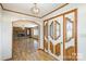 Inviting foyer featuring hardwood floors, decorative doors, and arched entryway at 4556 Harley Davidson Dr, Catawba, NC 28609