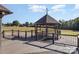 Picturesque gazebo on a large property with well-maintained decking, offering serene outdoor space at 4556 Harley Davidson Dr, Catawba, NC 28609