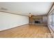 Bright living room featuring hardwood floors, stone fireplace, and ample space at 4556 Harley Davidson Dr, Catawba, NC 28609