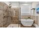 Spa-like bathroom with soaking tub and walk-in shower at 7014 Jolly Brook Dr, Charlotte, NC 28215