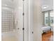 Bathroom and bedroom with a shower and hardwood floors at 7014 Jolly Brook Dr, Charlotte, NC 28215