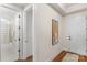 Bright hallway with access to bathroom; includes tub and shower at 7014 Jolly Brook Dr, Charlotte, NC 28215