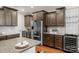 Modern kitchen with stainless steel appliances and granite countertops at 7014 Jolly Brook Dr, Charlotte, NC 28215