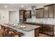 Large kitchen island with seating and granite countertops at 7014 Jolly Brook Dr, Charlotte, NC 28215