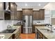 Modern kitchen featuring stainless steel appliances and granite countertops at 7014 Jolly Brook Dr, Charlotte, NC 28215