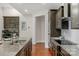 Modern kitchen with double sink, granite counters, and stainless steel appliances at 7014 Jolly Brook Dr, Charlotte, NC 28215