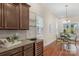 Kitchen features granite countertops, modern cabinetry, and a wine cooler at 7014 Jolly Brook Dr, Charlotte, NC 28215