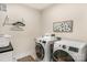 Laundry room with washer, dryer and hanging rack at 7014 Jolly Brook Dr, Charlotte, NC 28215