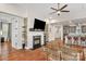 Open living room with fireplace and hardwood floors at 7014 Jolly Brook Dr, Charlotte, NC 28215