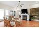 Spacious living room featuring a fireplace and built-in shelving at 7014 Jolly Brook Dr, Charlotte, NC 28215