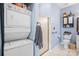 Bathroom and laundry area featuring stackable washer dryer and tiled shower at 8931 Meadow Vista Rd, Charlotte, NC 28213