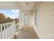 Charming front porch offers natural light and views of the surrounding landscape at 8931 Meadow Vista Rd, Charlotte, NC 28213