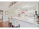 Updated kitchen with white cabinets, a breakfast bar and lots of natural light at 8931 Meadow Vista Rd, Charlotte, NC 28213