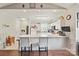 Bright kitchen featuring white cabinetry, stainless steel appliances and a breakfast bar at 8931 Meadow Vista Rd, Charlotte, NC 28213
