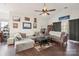 Inviting living room with vaulted ceilings, wood floors, and neutral decor offers an open and airy space at 8931 Meadow Vista Rd, Charlotte, NC 28213