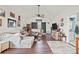 Spacious living room with hardwood floors, fan, and a seamless transition to the outdoors at 8931 Meadow Vista Rd, Charlotte, NC 28213