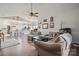 Inviting living room boasts hardwood floors and a seamless transition to the adjacent, modern kitchen at 8931 Meadow Vista Rd, Charlotte, NC 28213
