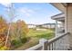 Balcony view of landscaped grounds, pool, and surrounding apartment buildings at 8931 Meadow Vista Rd, Charlotte, NC 28213