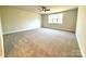 Expansive bedroom featuring a neutral color scheme, plush carpeting, and a large window to bring in natural light at 959 Tamary Way # 29/30, Landis, NC 28088