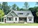 Charming craftsman home featuring white brick, green siding, and a well-manicured lawn at 959 Tamary Way # 29/30, Landis, NC 28088