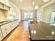 Open-concept kitchen featuring a large island and modern fixtures with lots of light at 959 Tamary Way # 29/30, Landis, NC 28088