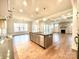 Kitchen with island seamlessly connects to living room and fireplace at 959 Tamary Way # 29/30, Landis, NC 28088