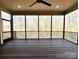 A covered porch offers an outdoor retreat with a ceiling fan and views of the surrounding landscape at 959 Tamary Way # 29/30, Landis, NC 28088