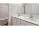 Modern bathroom with double vanity and white cabinets at 108 Mountain Bridge Way, Statesville, NC 28625