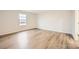 Simple bedroom with light gray carpeting and a window offering natural light at 108 Mountain Bridge Way, Statesville, NC 28625