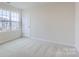 Spacious bedroom with gray carpeting and a window with a view at 108 Mountain Bridge Way, Statesville, NC 28625