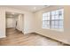 Spacious dining area with light wood laminate flooring and large windows at 108 Mountain Bridge Way, Statesville, NC 28625