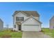 Two-story house with gray siding, white trim, and a two-car garage at 108 Mountain Bridge Way, Statesville, NC 28625