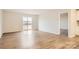 Bright Gathering room featuring light wood laminate flooring and sliding glass doors at 108 Mountain Bridge Way, Statesville, NC 28625