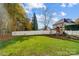 Landscaped backyard with playground and large green lawn at 124 Harris Farm Rd, Mooresville, NC 28115