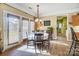 Sunlit dining area featuring a round table and access to the outdoors at 124 Harris Farm Rd, Mooresville, NC 28115