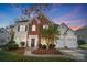 Brick two-story house with a two-car garage and landscaping at 124 Harris Farm Rd, Mooresville, NC 28115