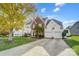 Two-story house with a large driveway and mature tree at 124 Harris Farm Rd, Mooresville, NC 28115