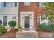 Attractive front entry with brick detailing and landscaping at 124 Harris Farm Rd, Mooresville, NC 28115