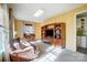 Bright living room with hardwood floors, large windows, and a cozy seating area at 124 Harris Farm Rd, Mooresville, NC 28115