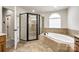 Bathroom with a glass shower, soaking tub, and tiled surround at 373 Fischer Rd, Fort Mill, SC 29715