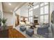 Open-concept living room with tall ceilings, fireplace, and access to the kitchen at 373 Fischer Rd, Fort Mill, SC 29715